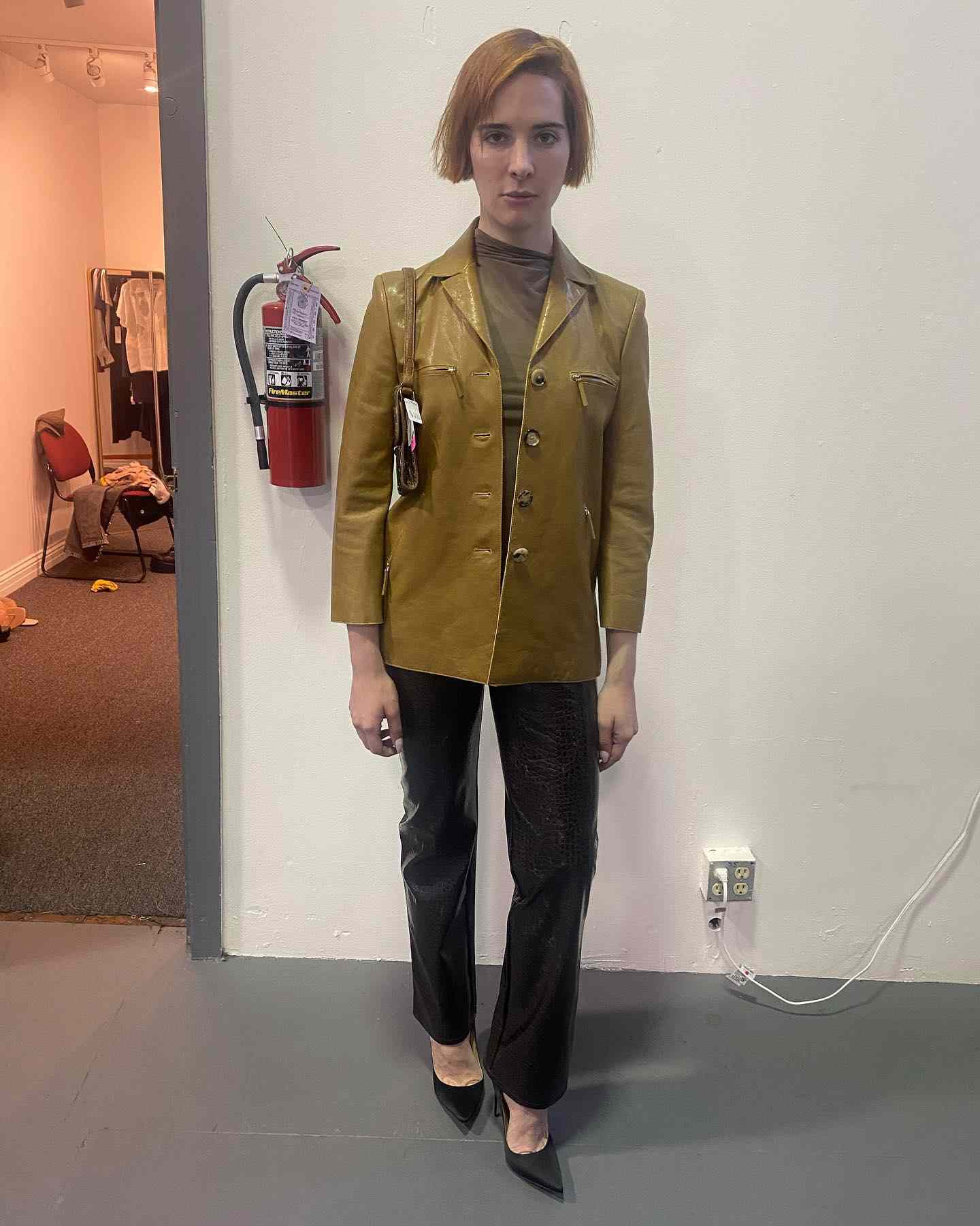 Hari Nef in a leather blazer